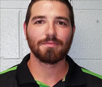 Male SERVPRO employee, brown hair and beard