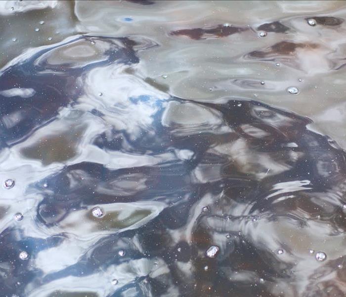 close up of water with bubbles on surface
