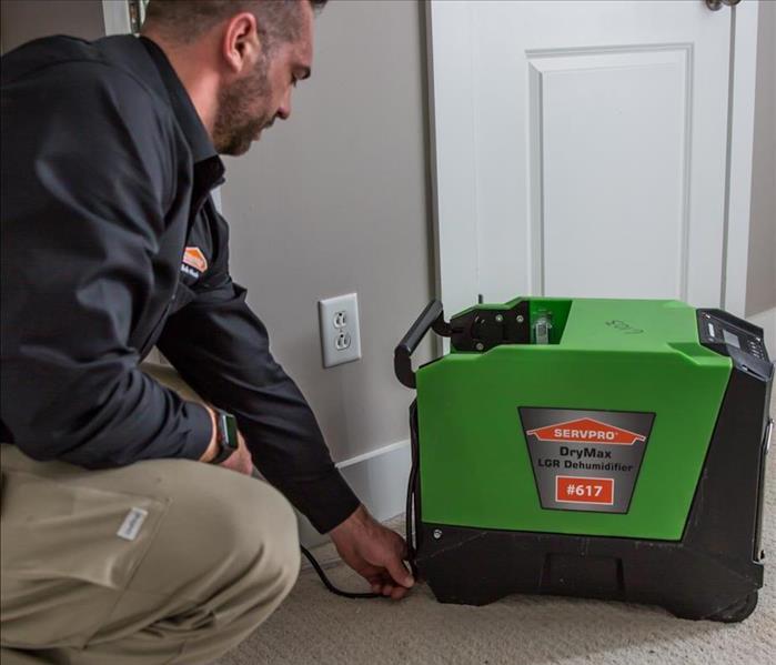 SERVPRO Technician with equipment 