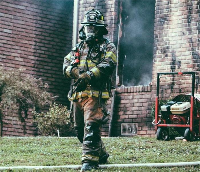 firefighter after fire in business
