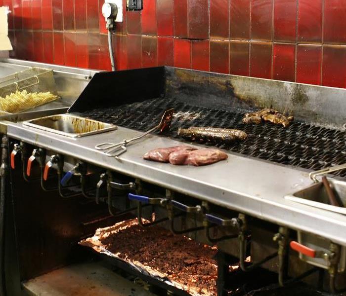 food being cooked in restaurant kitchen